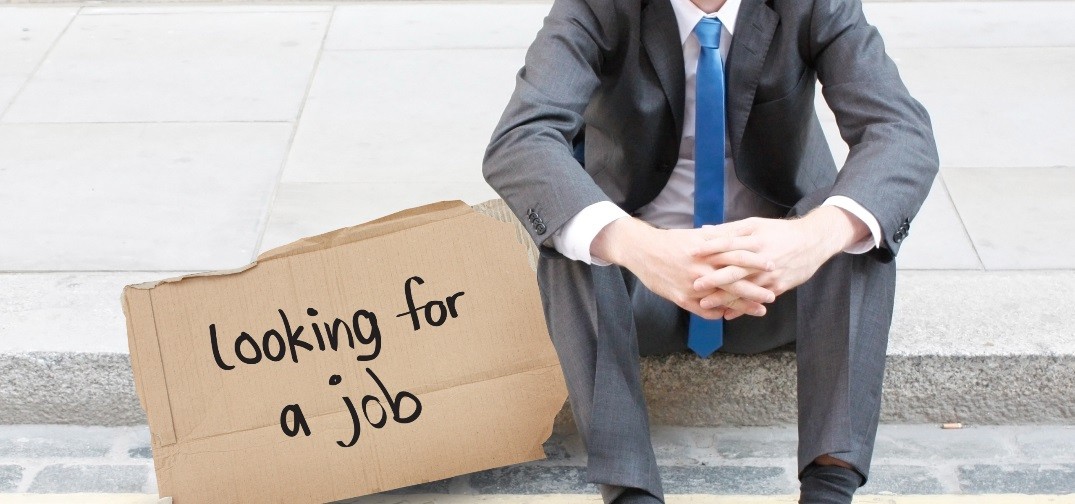 Your Best Employees May Be Job Hunting - Business Person Sitting On Sidewalk Curb With Job Sign