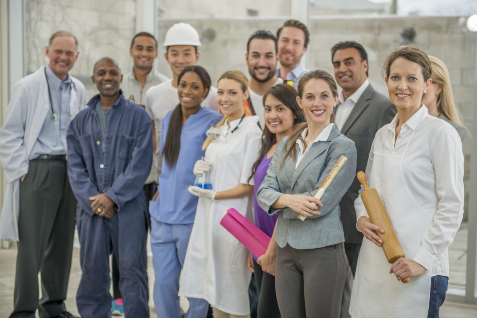 Results Oriented, Driven by Passion, Guided by Expertise - Smiling Crowd From Various Careers