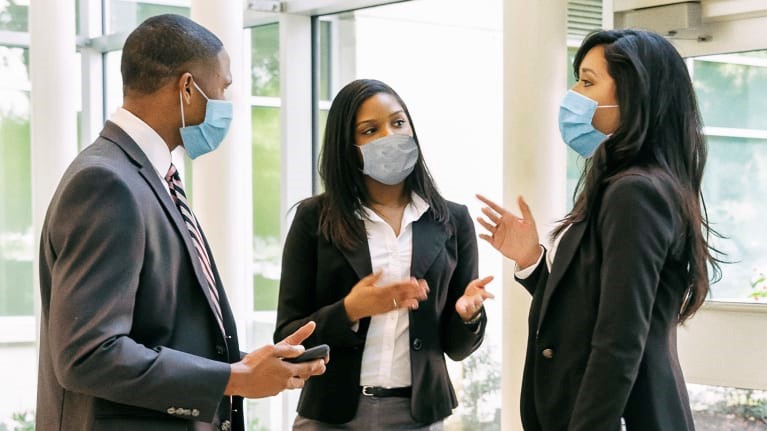 Employees wearing facemasks